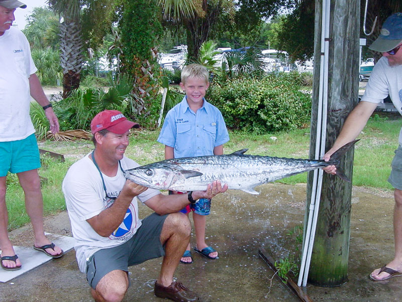 Chris Bernacki  Helping a Junior Angler with his Kingfish